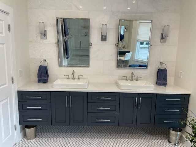 dual sink navy blue vanity with silver hardware, silver bathroom faucets, bathroom mirrors