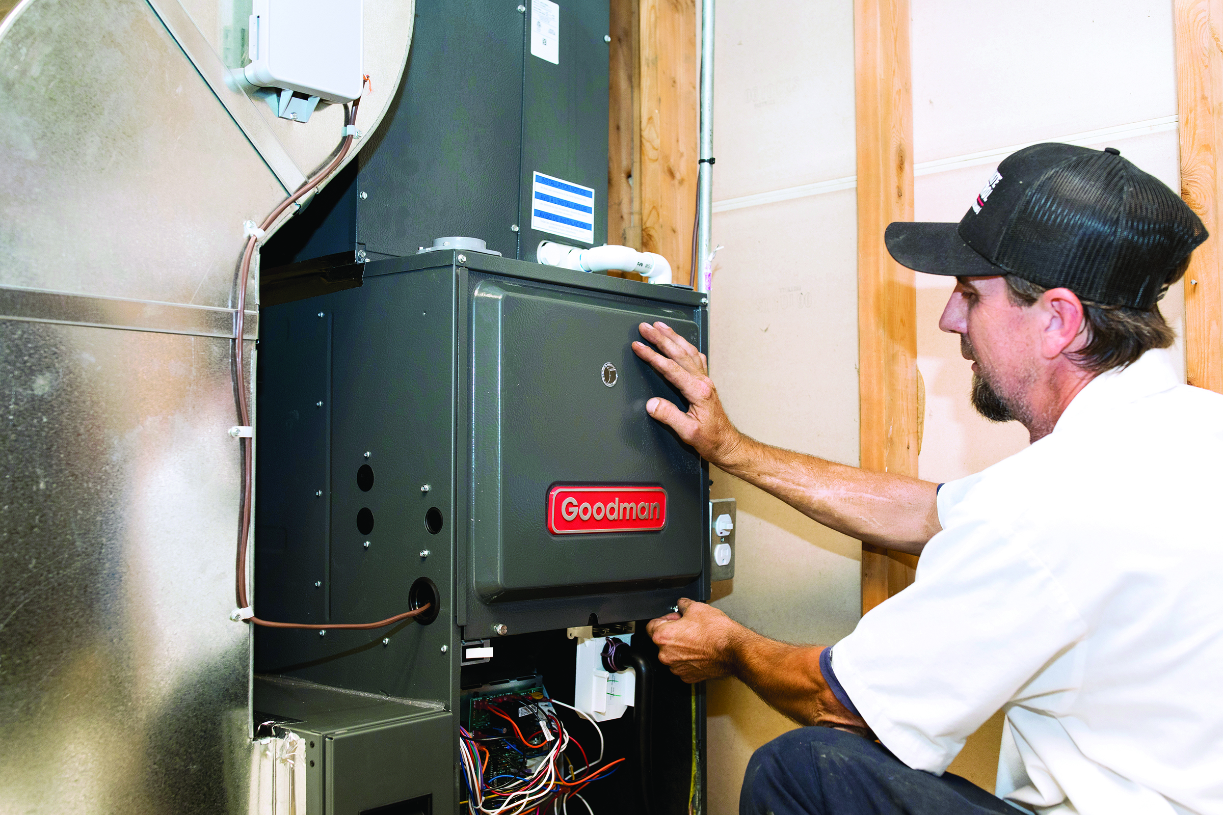 Technician installing a Goodman furnace