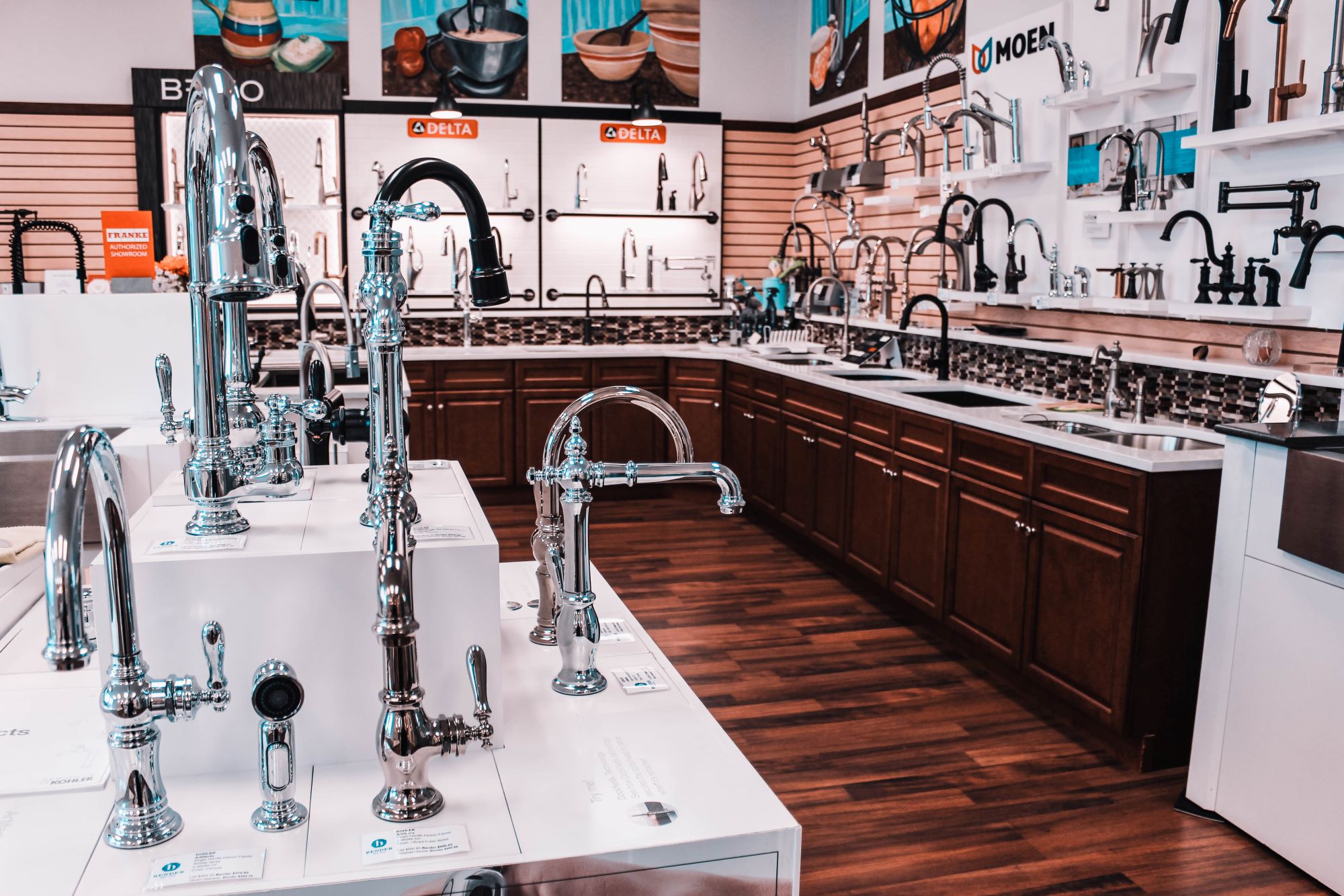 Faucets, dark wooden cabinets, hardwood floor, faucet showroom