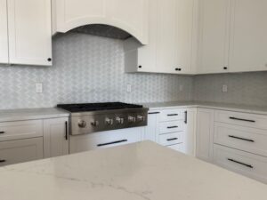 cream kitchen with white backsplash