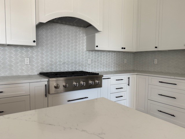 cream kitchen with white backsplash