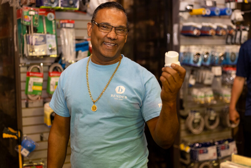 man holding plumbing supplies