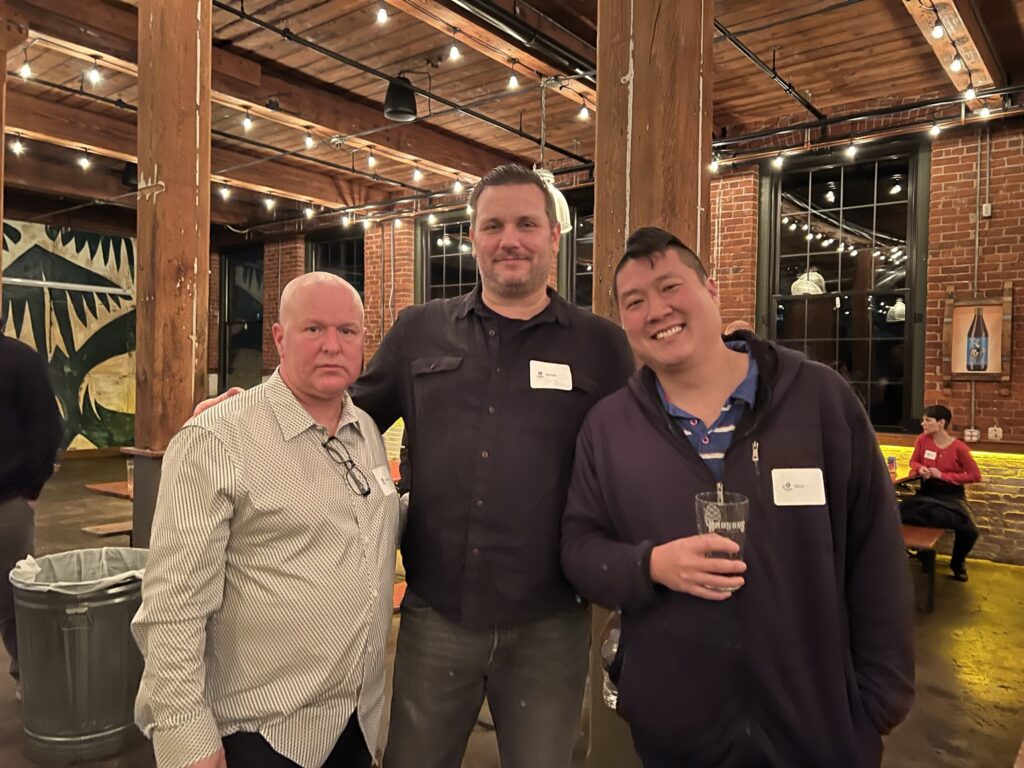 three men at a holiday party