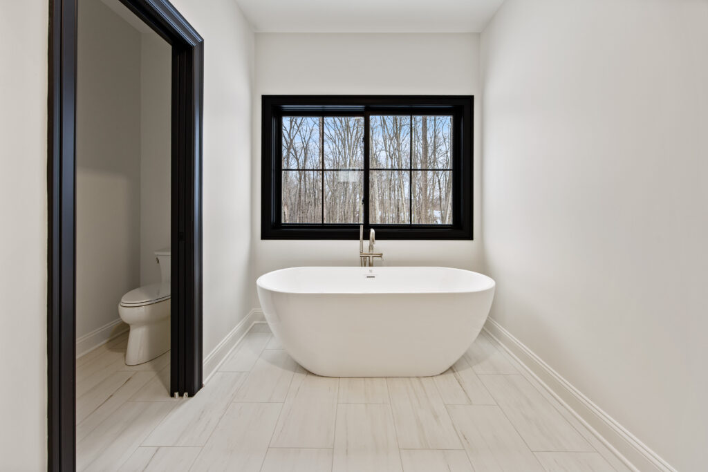 white freestanding tub brushed bronze bath filler