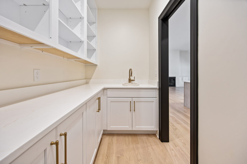 stone sink with brushed bronze fixture