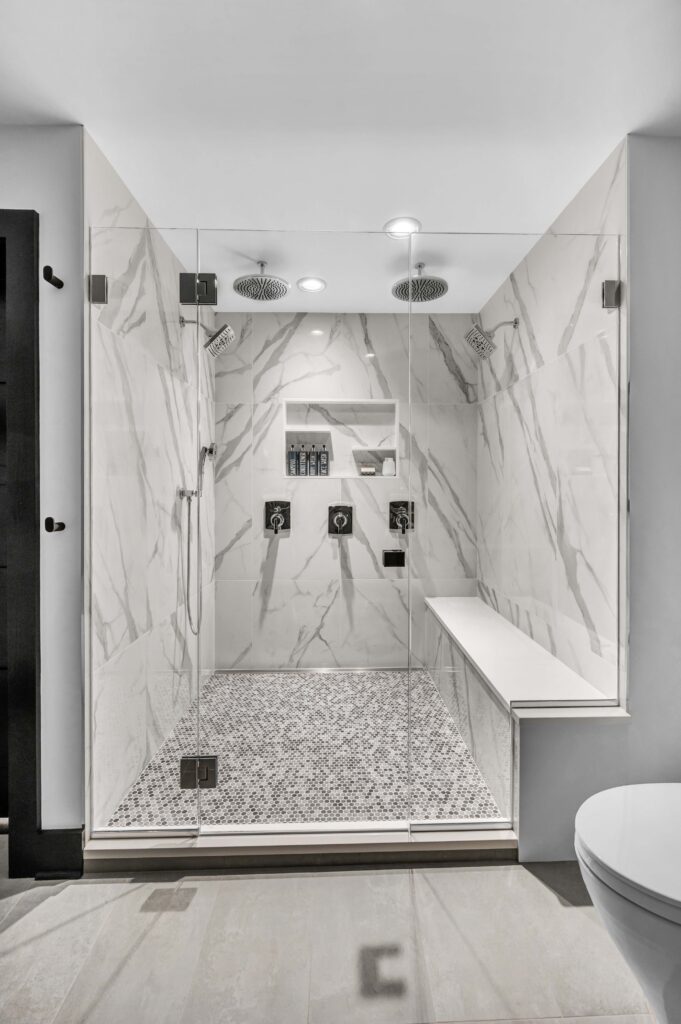 white marble shower with built in bench