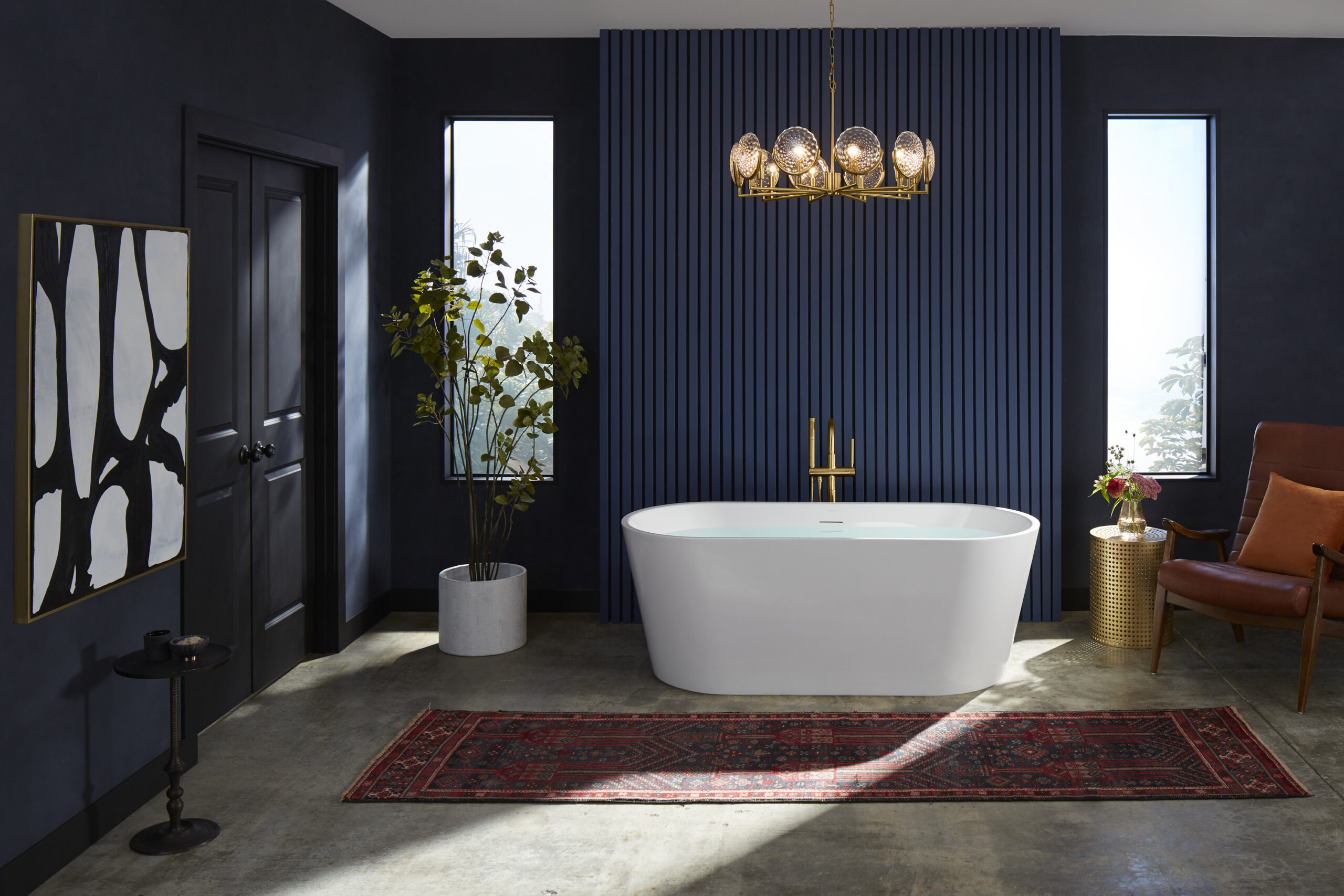 dark moody room with freestanding tub