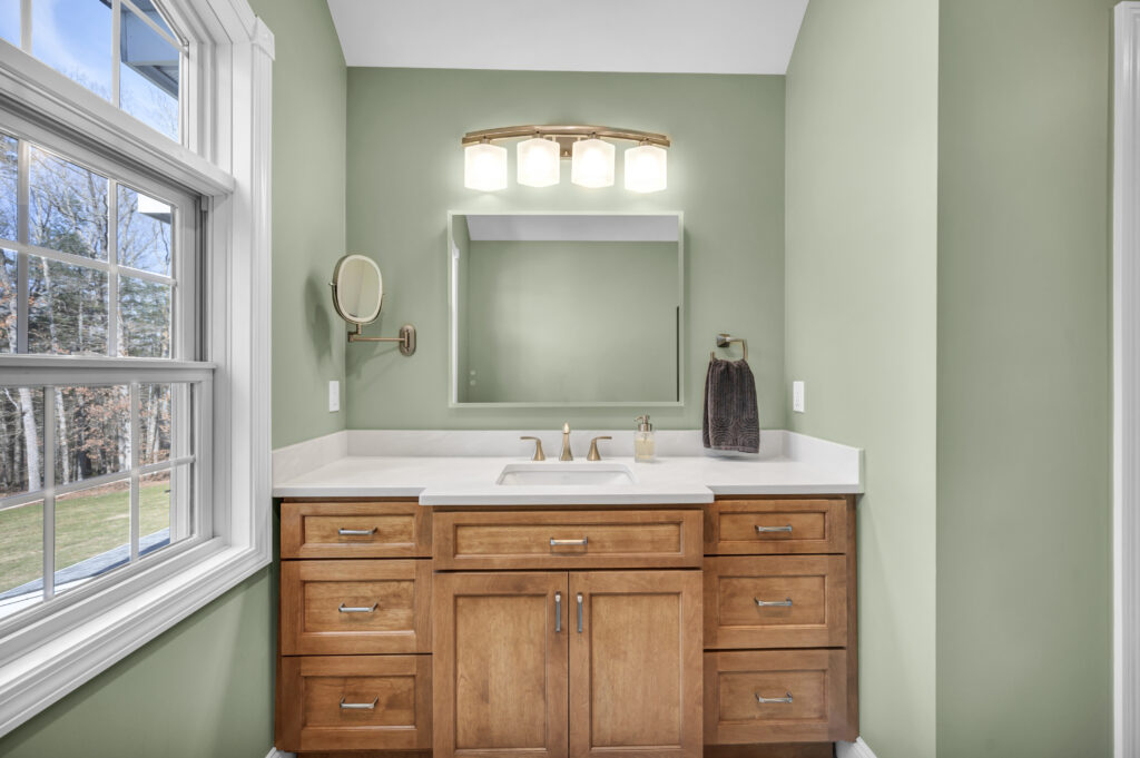 wood bathroom vanity with white counter top